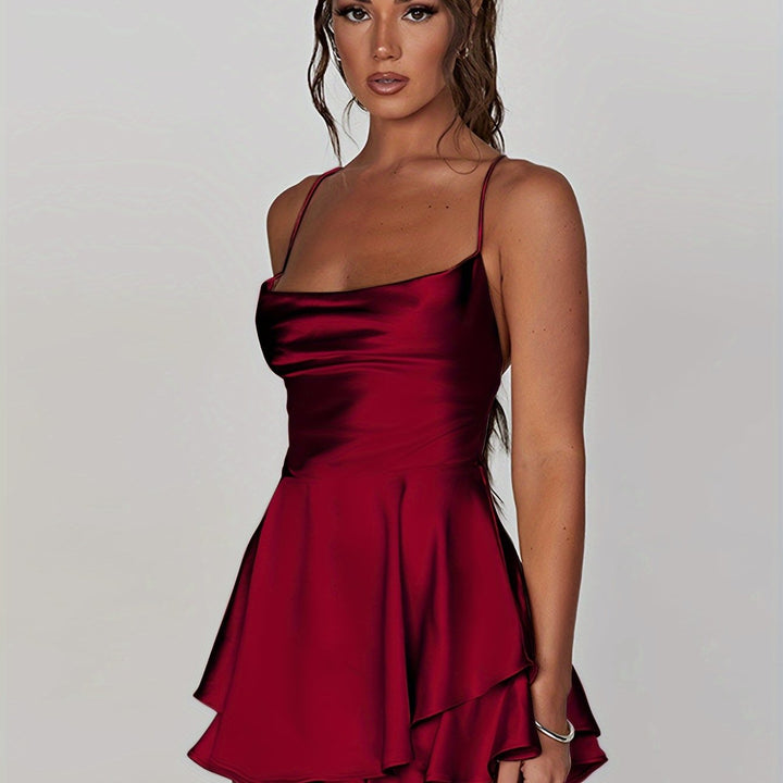 Eye-catching women's mini dress with ruched details & tiered skirt. Ideal for homecoming parties.