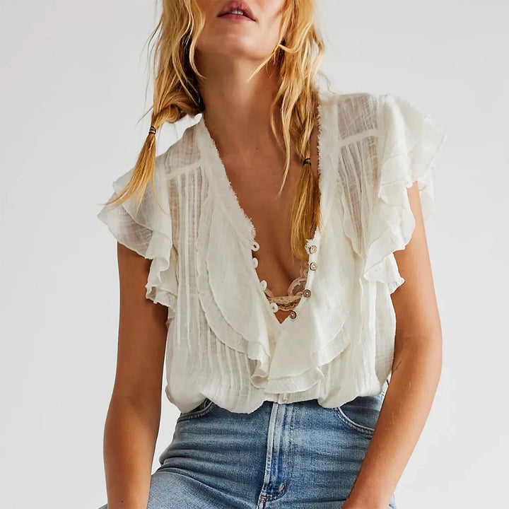 Summer women's top, cropped with a stylish ruffle front and flutter sleeves.