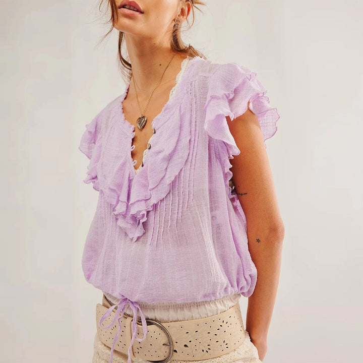 Holiday-ready women's crop top, featuring ruffles and a comfortable relaxed fit.