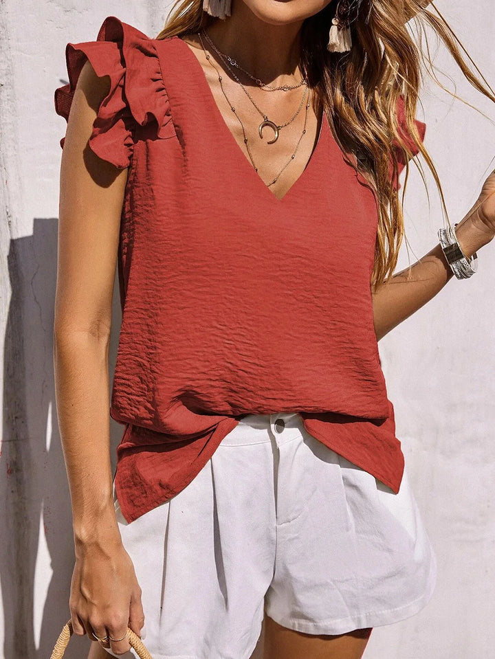 Elegant women's ruffle sleeve V-neck blouse. A trendy, loose-fit summer top for effortless casual and vacation style.