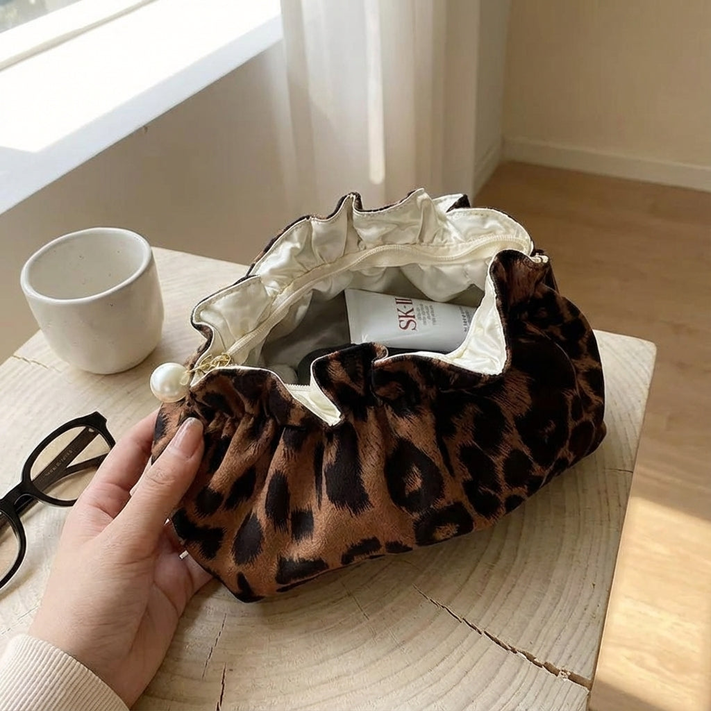 Women's Ruffle Top Cosmetic Bag Pearlynn, a stylish leopard print makeup pouch for elegant organization.