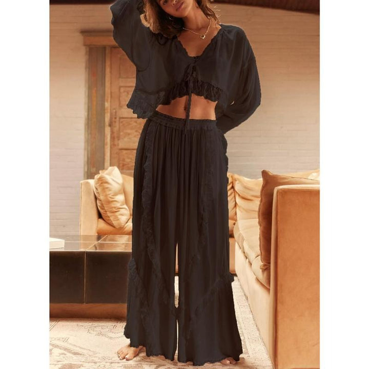 Women's ruffle trim two-piece lounge set with cropped top & wide-leg pants. Comfortable cotton blend for casual wear.