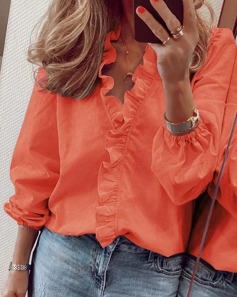 Women's Ruffle V-Neck Blouse with long sleeves, offering an elegant, flattering fit for casual or dressy occasions.
