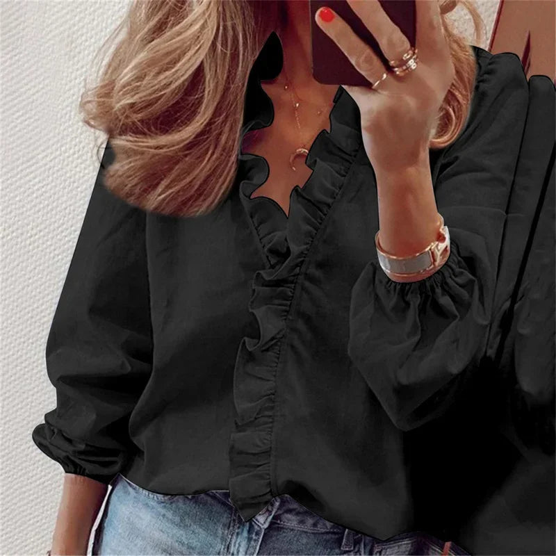 Casual yet chic women's blouse with a relaxed fit & delicate ruffle V-neck. Perfect for everyday feminine style.