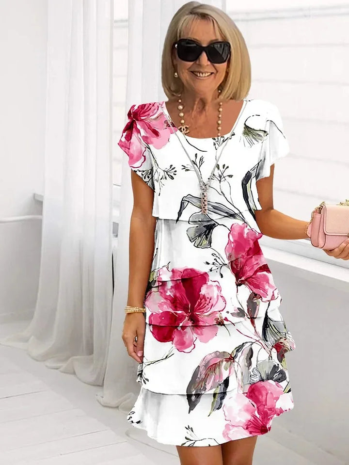 Women's ruffled floral pleated midi dress with adjustable straps. Perfect for spring and summer fashion.
