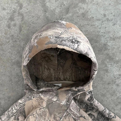 Trendy women's camo zip jacket, offering rugged urban style & cozy comfort for everyday wear.