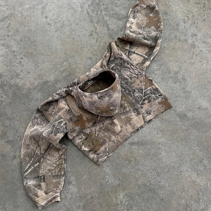 Versatile women's camo sweater, blending urban fashion with practical outdoor casual wear.