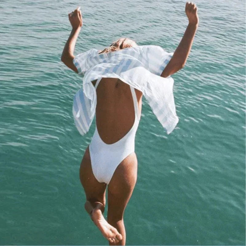 Chic women's open back one-piece swimsuit featuring a classic scoop neck, great for summer style.