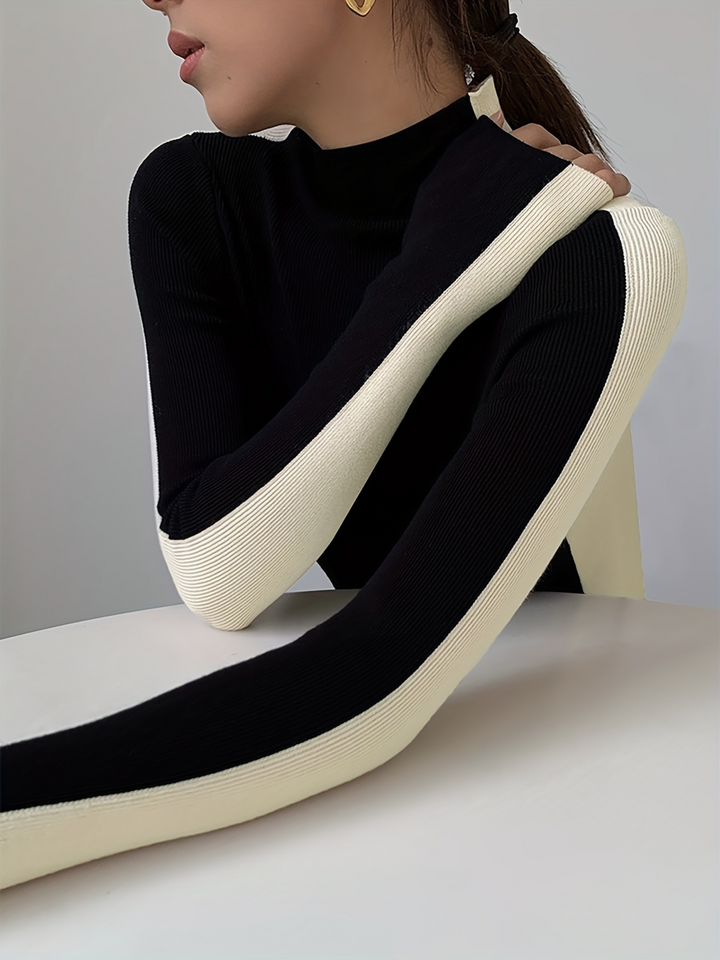 Soft stretch knit turtleneck sweater for women, sculpted slim fit with stylish contrast design.