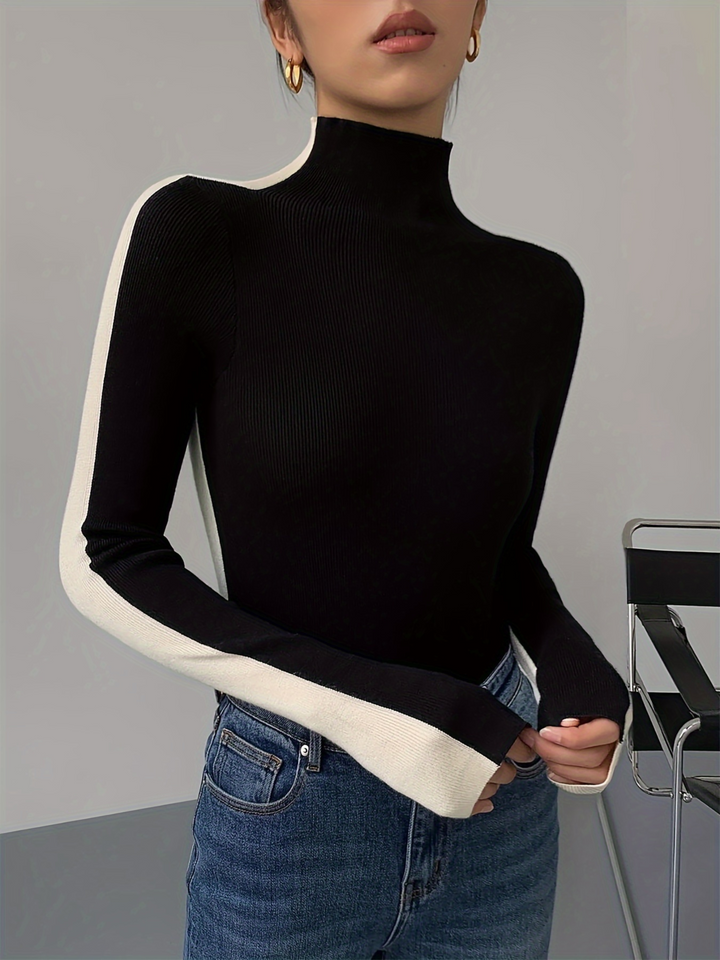 Fashionable women's long sleeve sculpted turtleneck sweater, contrast knit design.