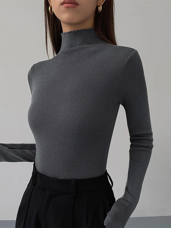 Women's elegant sculpted knit turtleneck, long sleeve & stretch, featuring contrast style.