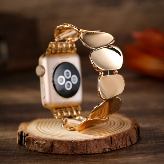 Women's sculpted metal watch band with elegant stretch-fit links for smartwatches.