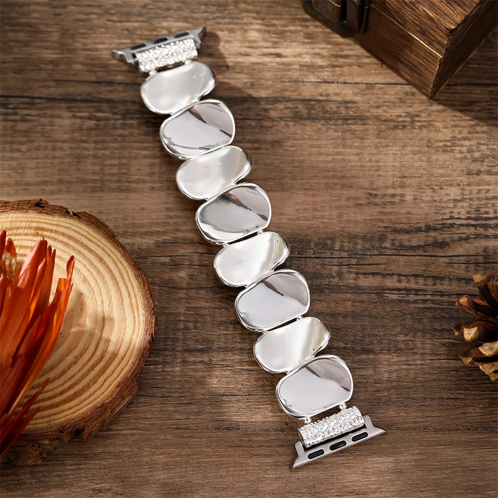 Women's designer sculpted metal watch accessory, offering both elegance and function.
