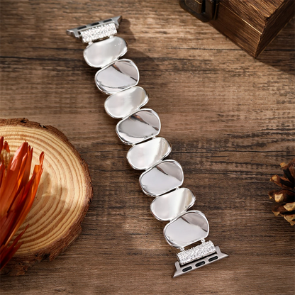 Women's designer sculpted metal watch accessory, offering both elegance and function.