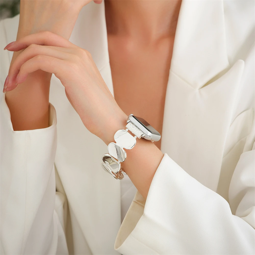Gold-finished sculpted metal band for women, elevating any smartwatch with style.