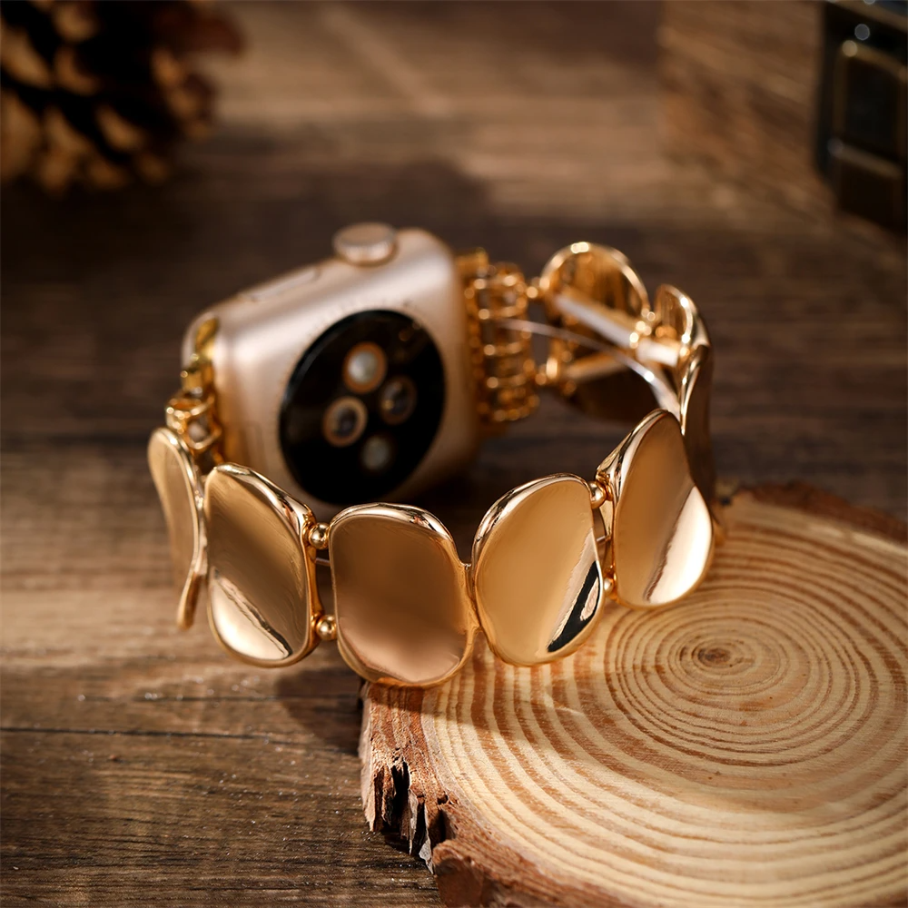 Gold-tone sculpted metal watchband, jewelry style, perfect accessory for women's smartwatches.