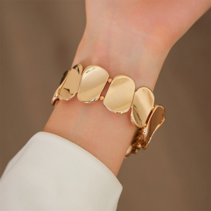 Jewelry-inspired sculpted metal smartwatch band for women, enhances device style.
