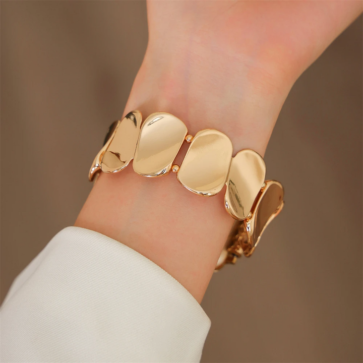 Jewelry-inspired sculpted metal smartwatch band for women, enhances device style.
