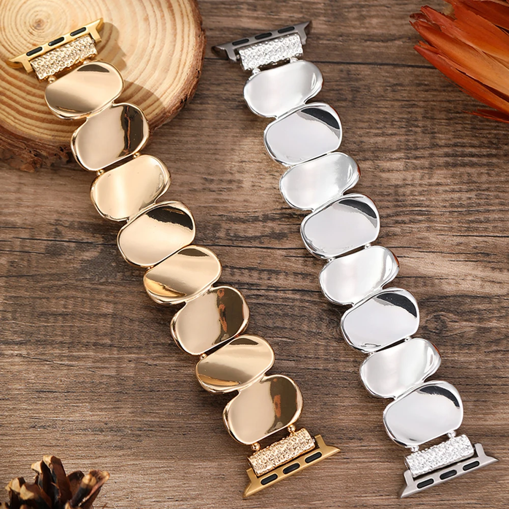 Women's gold sculpted metal watch strap, a chic and secure device band.