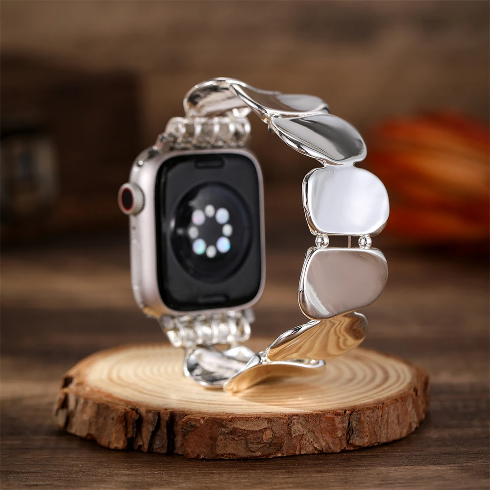 Silver sculpted link watch band for women, modern and sophisticated smartwatch accessory.