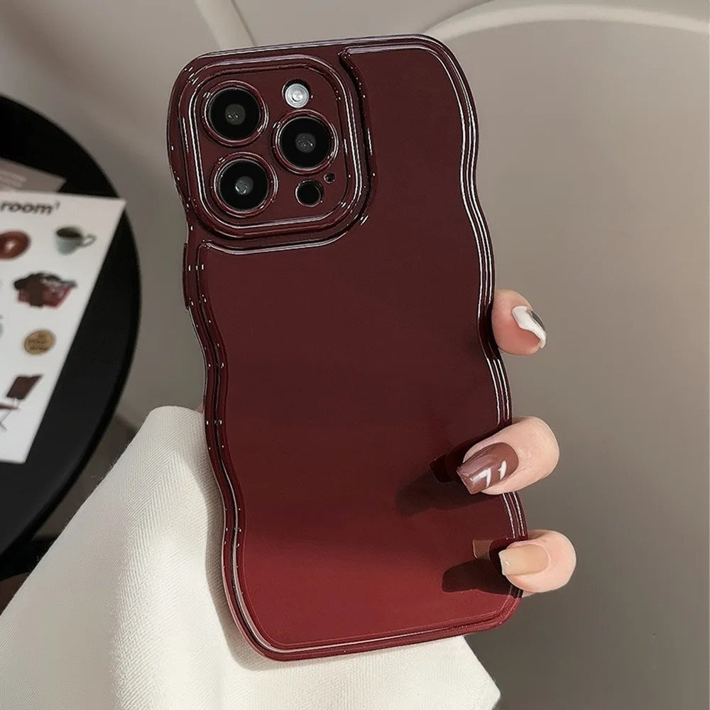 Stylish women's phone cover with a unique sculpted ripple pattern, glossy finish, and shock protection.