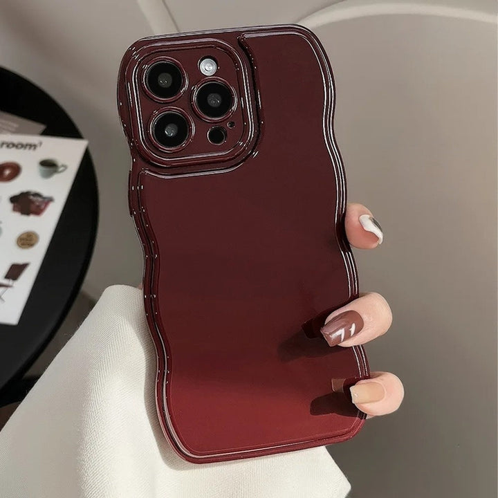 Stylish women's phone cover with a unique sculpted ripple pattern, glossy finish, and shock protection.