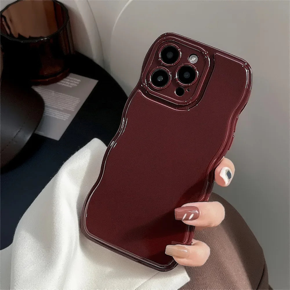 Shock-absorbent sculpted ripple iPhone case for women, offering durable protection & a sleek gloss finish.