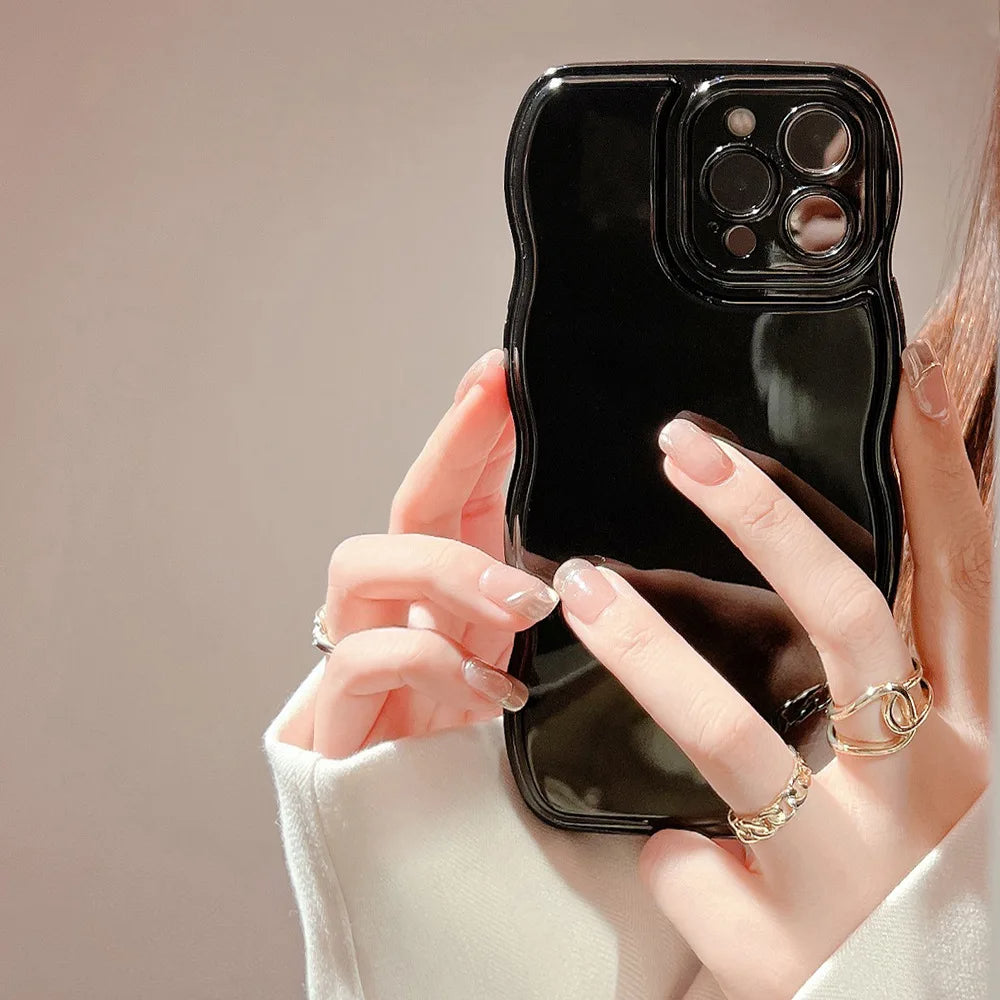 Elegant women's tech accessory: sculpted ripple iPhone case with a glossy surface and superior shock absorption.