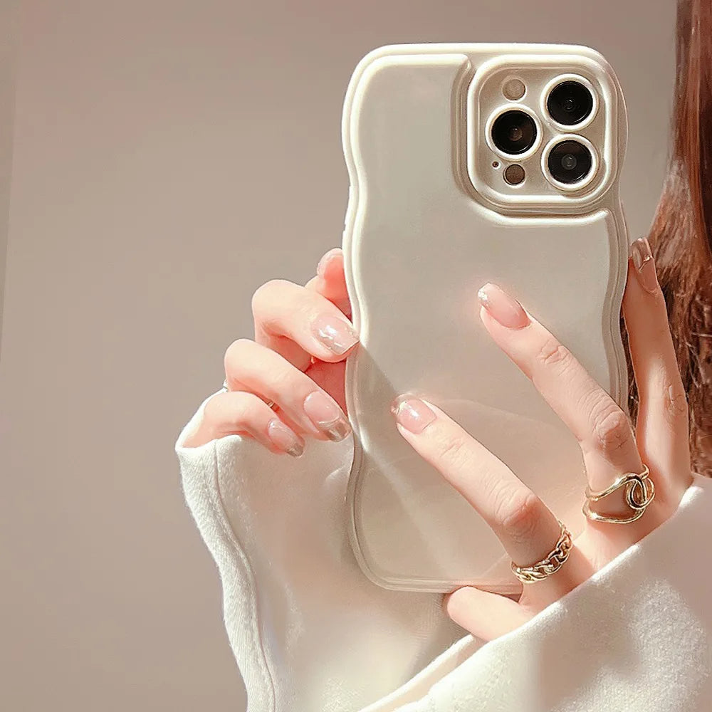 Close-up of a women's sculpted ripple iPhone case, highlighting its glossy texture & shock-absorbent build.