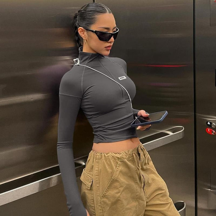 Modern women's fitted sculpting crop top with zip. Long sleeve for stylish, versatile fashion and comfort.