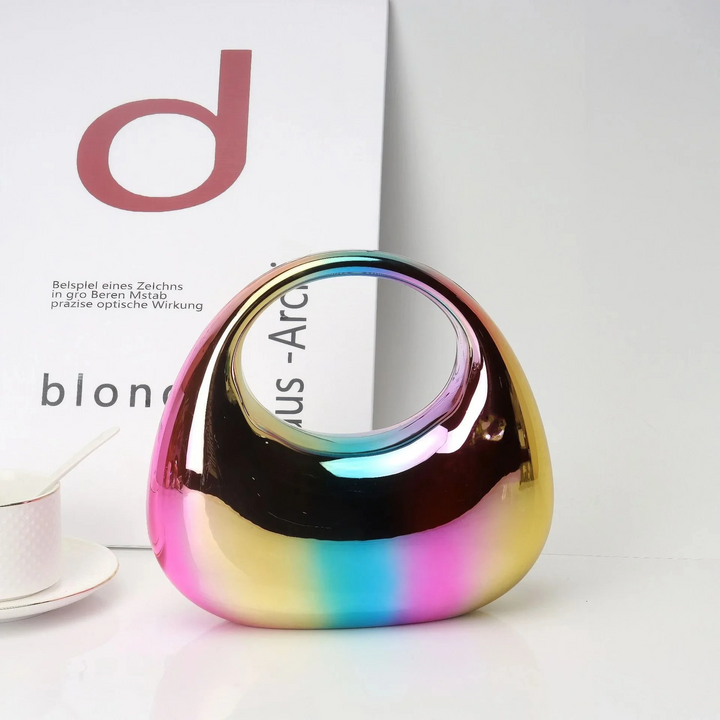 Statement sculptural women's clutch, mirror finish, for a dazzling fashion statement.