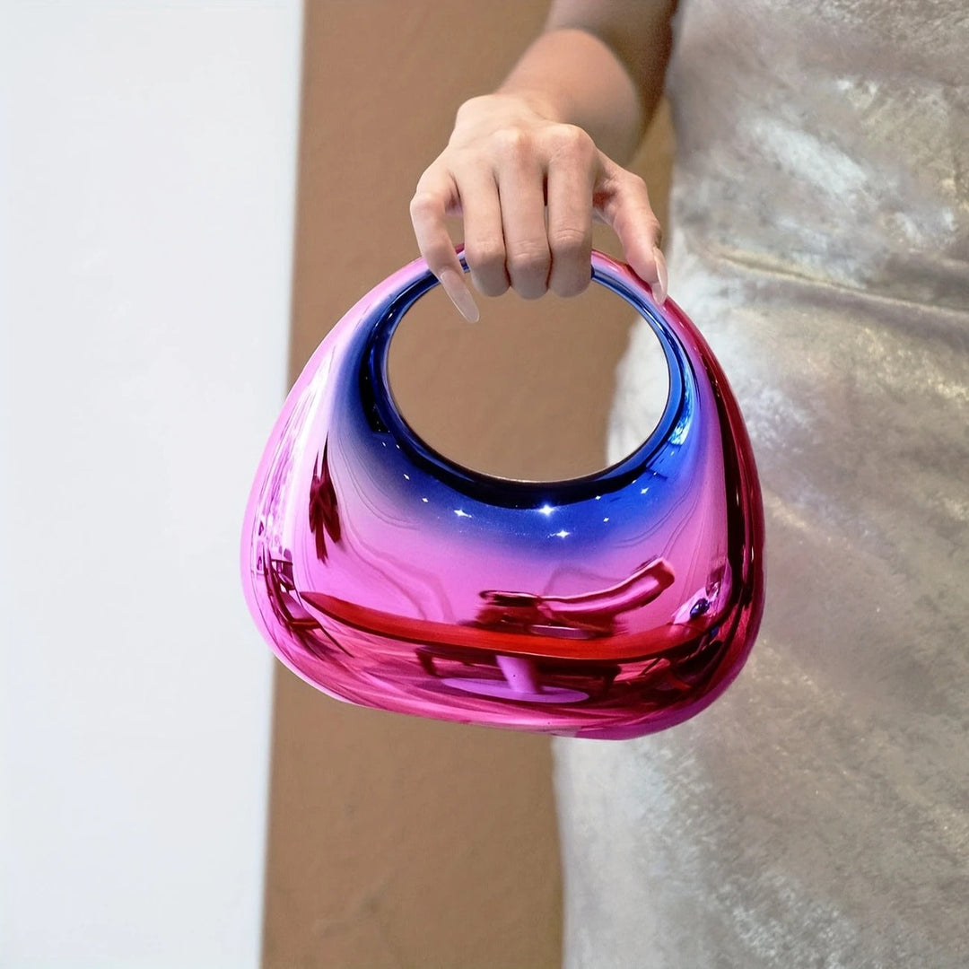 Women's fashionable party clutch, mirror finish, unique sculptural form.