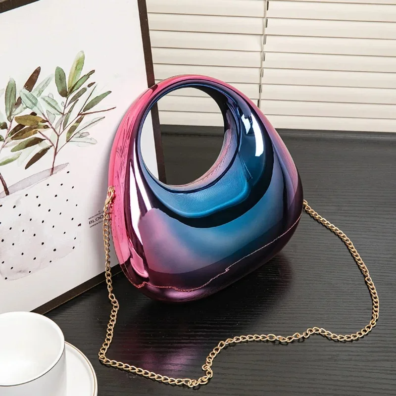 Chic women's sculptural clutch, mirror finish, perfect for formal events and parties.