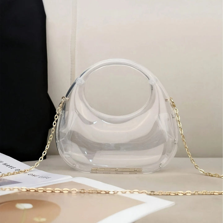 Acrylic sculptural women's evening bag with a distinctive mirror finish.