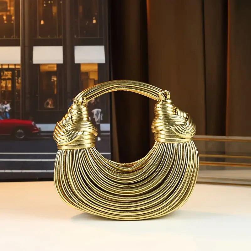 Women's sculptural vegan leather handbag, a luxury fashion accessory perfect for a statement look.