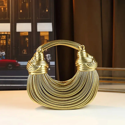 Women's sculptural vegan leather handbag, a luxury fashion accessory perfect for a statement look.
