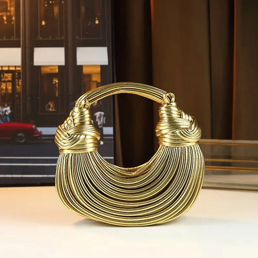 Women's sculptural vegan leather handbag, a luxury fashion accessory perfect for a statement look.