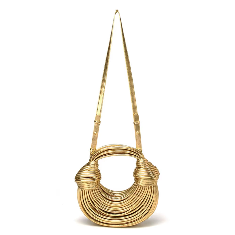 Chic sculptural vegan leather handbag for women. Stylish luxury accessory, perfect statement bag.