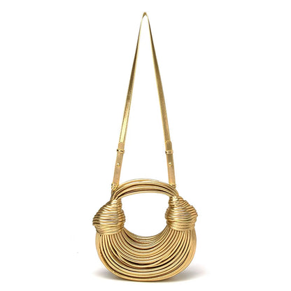 Chic sculptural vegan leather handbag for women. Stylish luxury accessory, perfect statement bag.