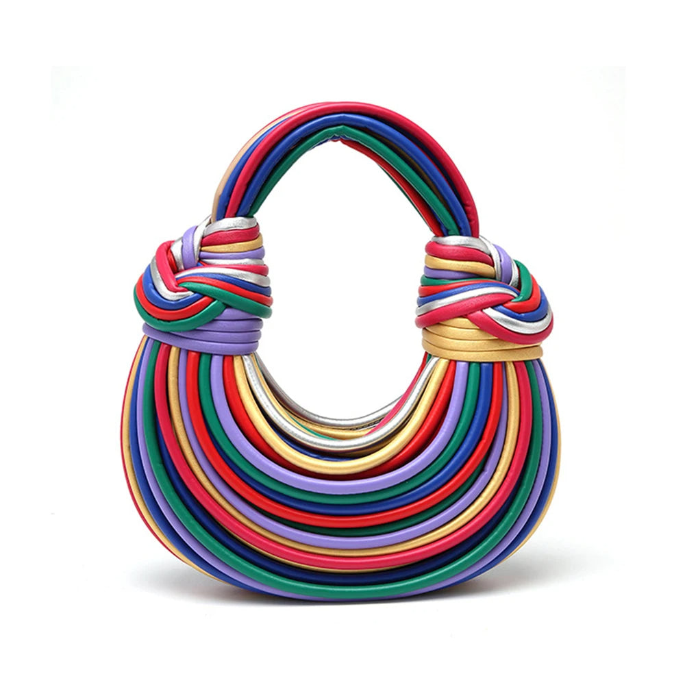Modern sculptural vegan leather handbag for women. Sleek design, a luxury fashion statement bag.