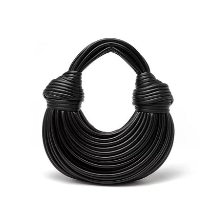 Bold sculptural vegan leather women's handbag. A true fashion statement & luxury accessory.
