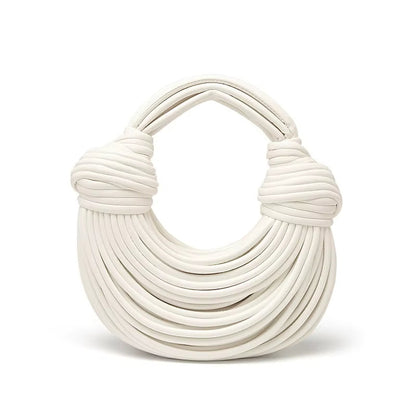Women's luxury sculptural vegan leather bag. Elegant crossbody & shoulder style fashion accessory.