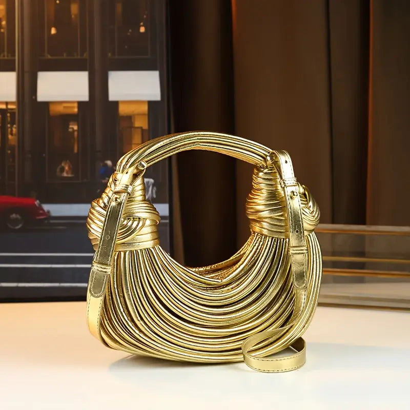 Premium vegan leather shoulder bag, sculptural design for women. Elegant & luxurious accessory.
