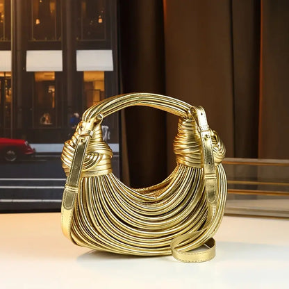 Premium vegan leather shoulder bag, sculptural design for women. Elegant & luxurious accessory.