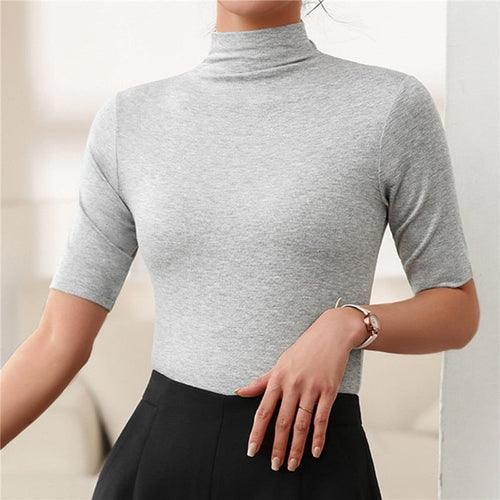 Versatile women's seamless slim fit turtleneck, an essential long sleeve top for everyday wear & layering.