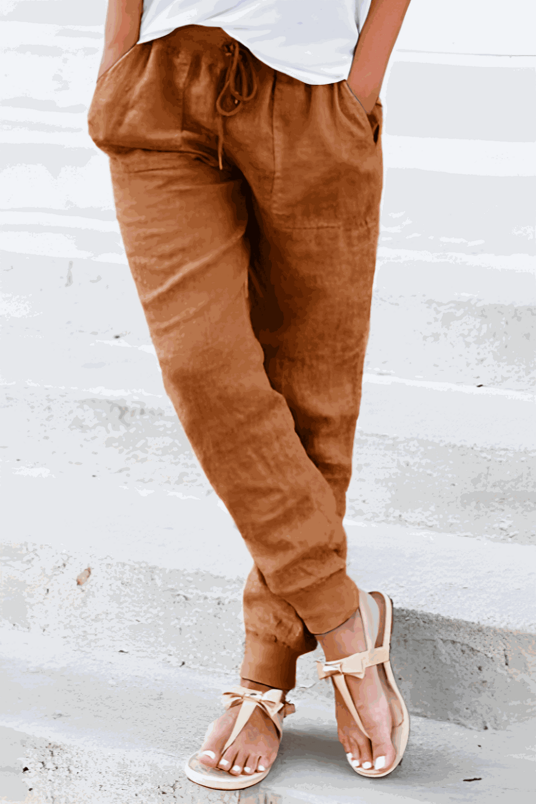 Woman in relaxed fit Sedona jogger pants, drawstring waist, comfortable & stylish for casual outings.