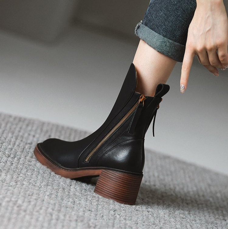 Pair of women's Selene chic ankle boots, ready to elevate any outfit with their fashionable and versatile design.