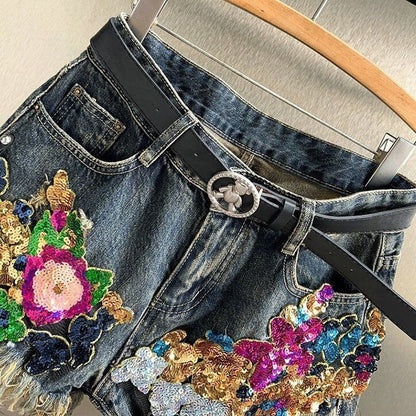 Embellished women's floral shorts with sparkling sequins & handmade details. Unique summer apparel.