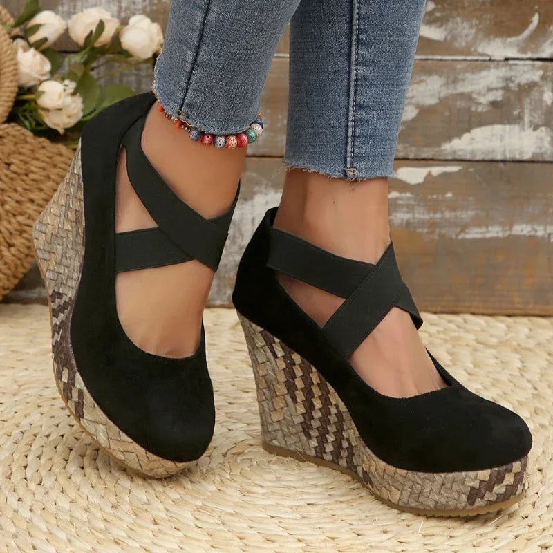 Fashionable black Serova wedges for women, offering superior comfort & elegant cross strap style.