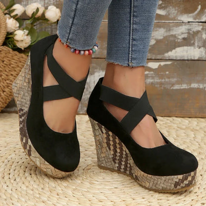 Fashionable black Serova wedges for women, offering superior comfort & elegant cross strap style.